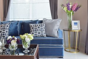 navy blue modern classic sofa set with beautiful flower vases in nice living corner